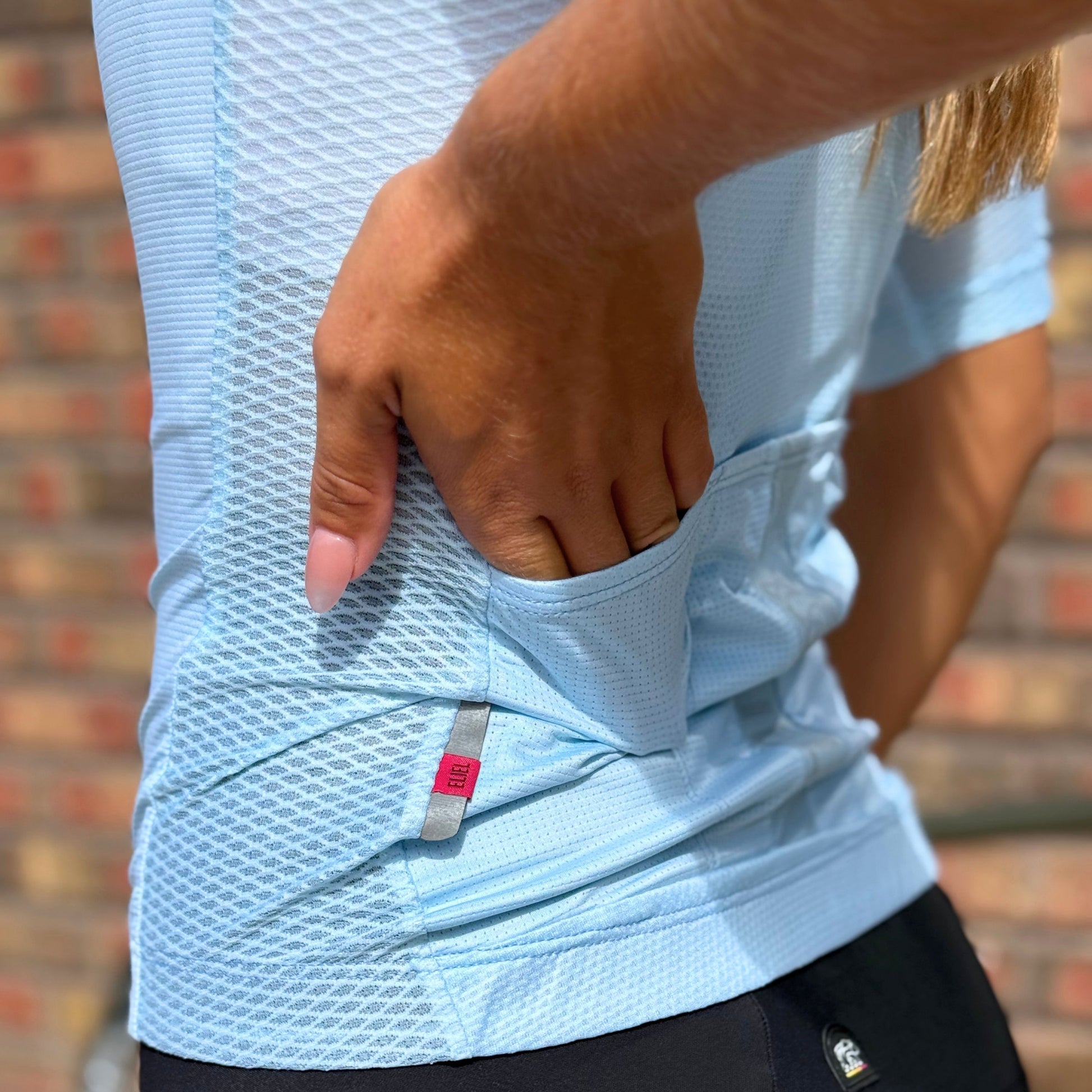 girl's hand in cycling pocket