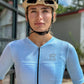 female cyclist in a blue jersey