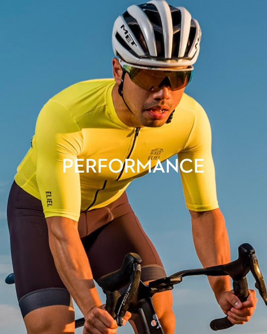 Man riding bike in yellow jersey